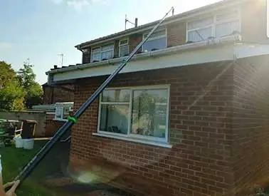 gutter-vacuuming-over-extension